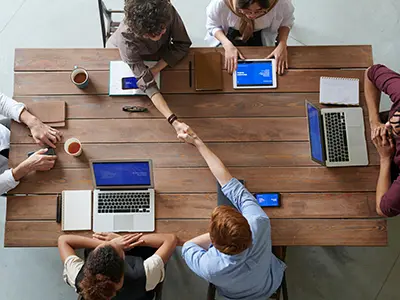 Students are shaking hands during a successful completion of AutoCAD internship in Ahmedabad.